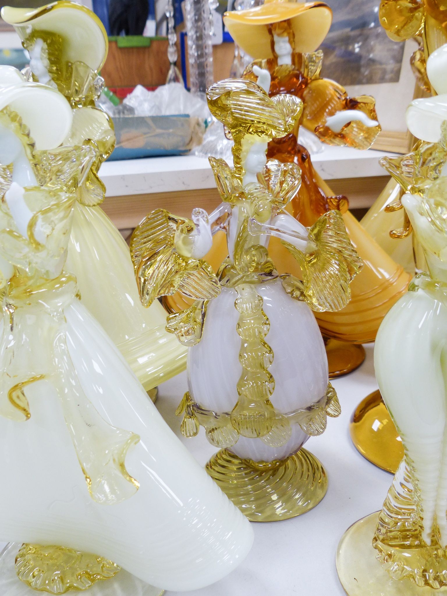 A collection of eight Murano amber glass figures, tallest 42cm